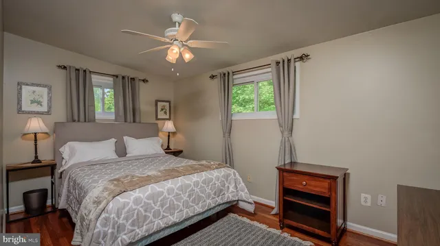 a bedroom with a bed and a tv