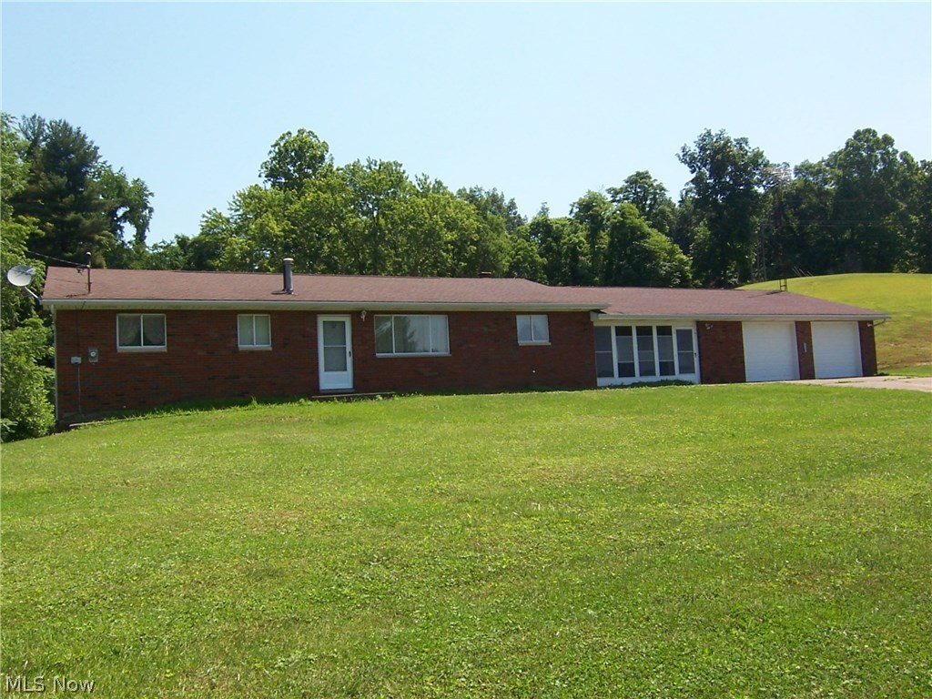 2560 Robinhood Road Washington, WV 26181 - Photo 1 of 35 12 acres, FREE GAS, 4 bedroom, 1.5, full basement, screened in breezeway, 2 car garage and 30x54 pole building.