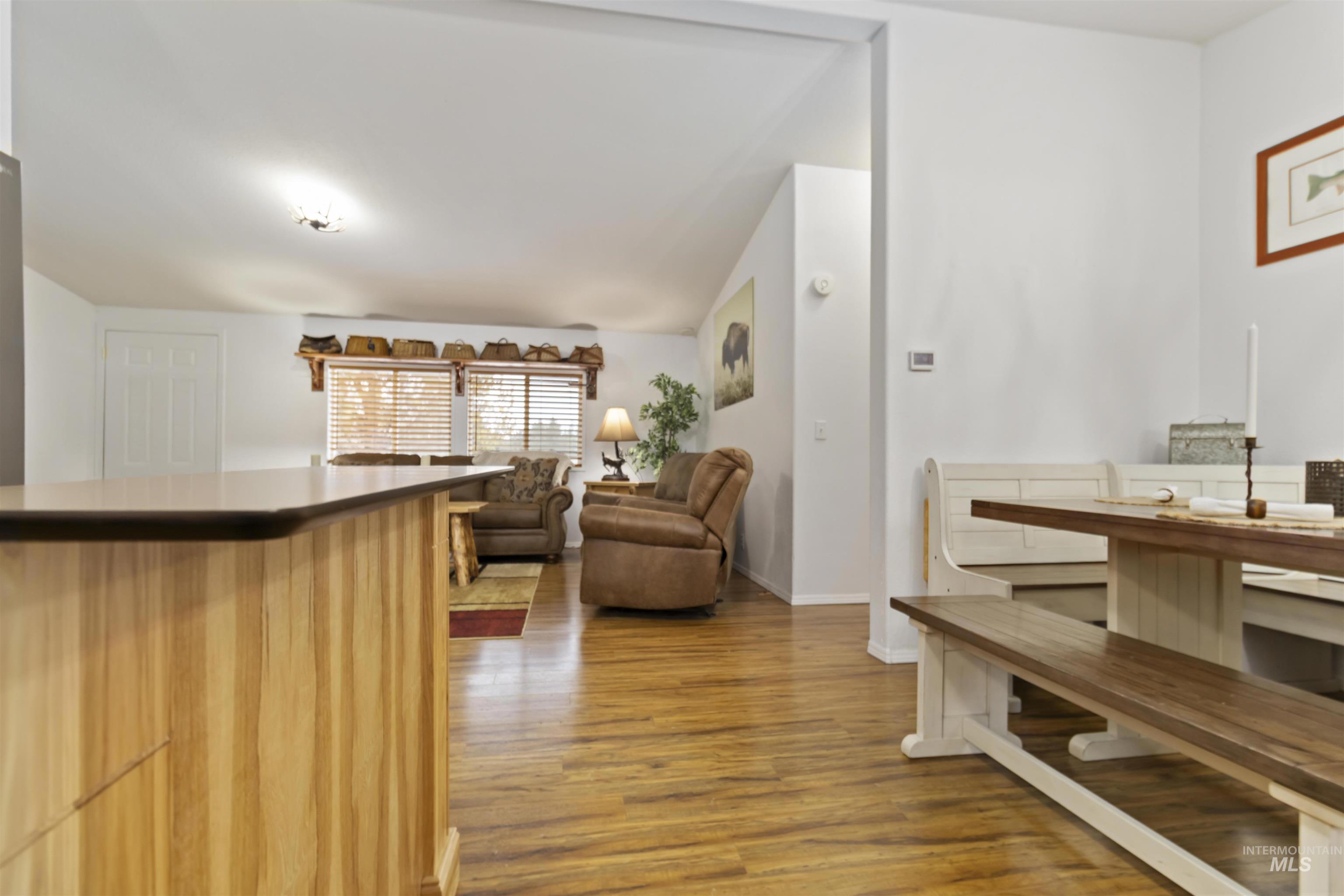 9592 Packer John Road Cascade, ID 83611 - Photo 22 of 47 Dining area featuring light wood finished floors and a dry bar