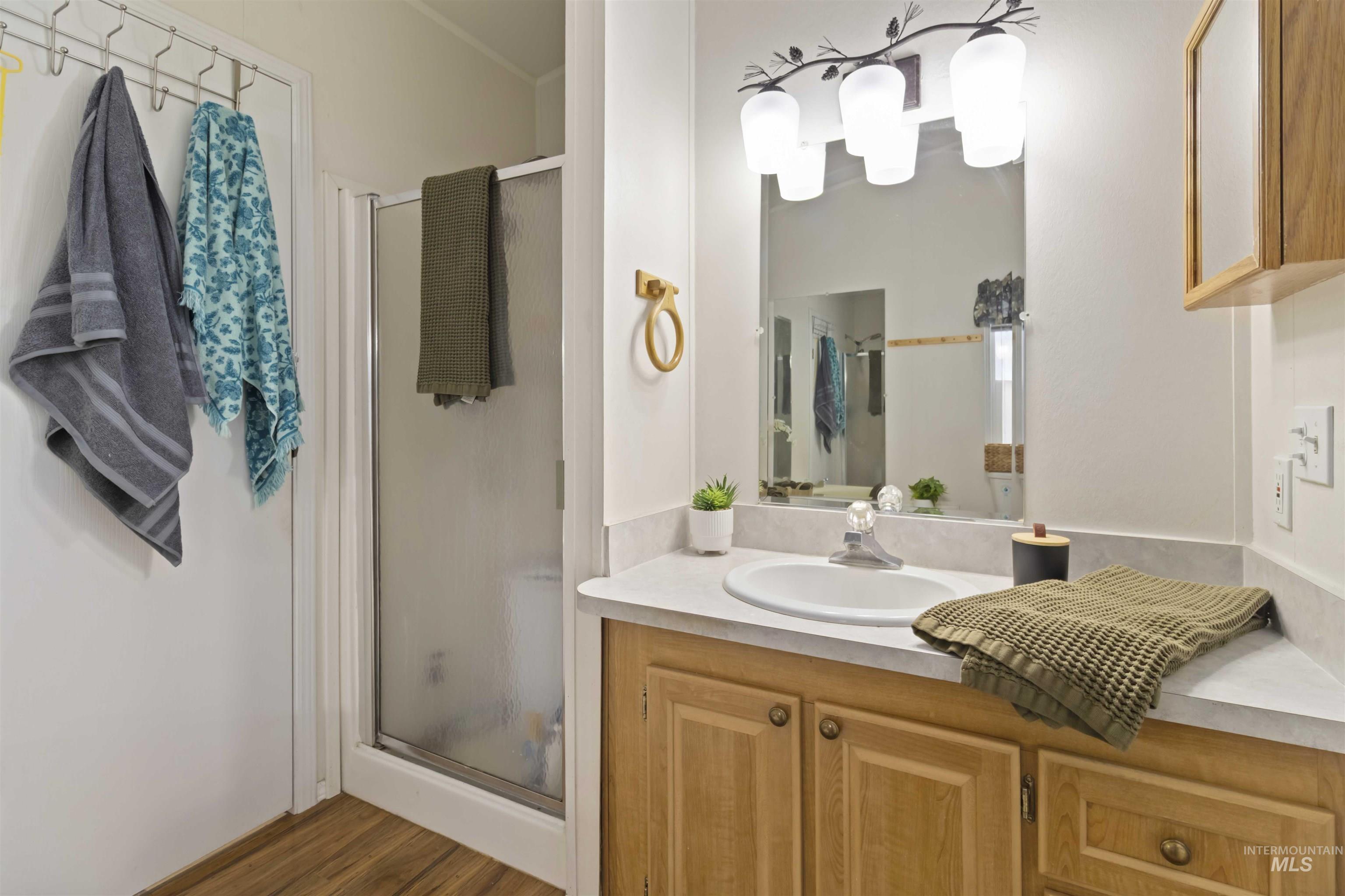 9592 Packer John Road Cascade, ID 83611 - Photo 27 of 47 Bathroom featuring a shower stall and vanity