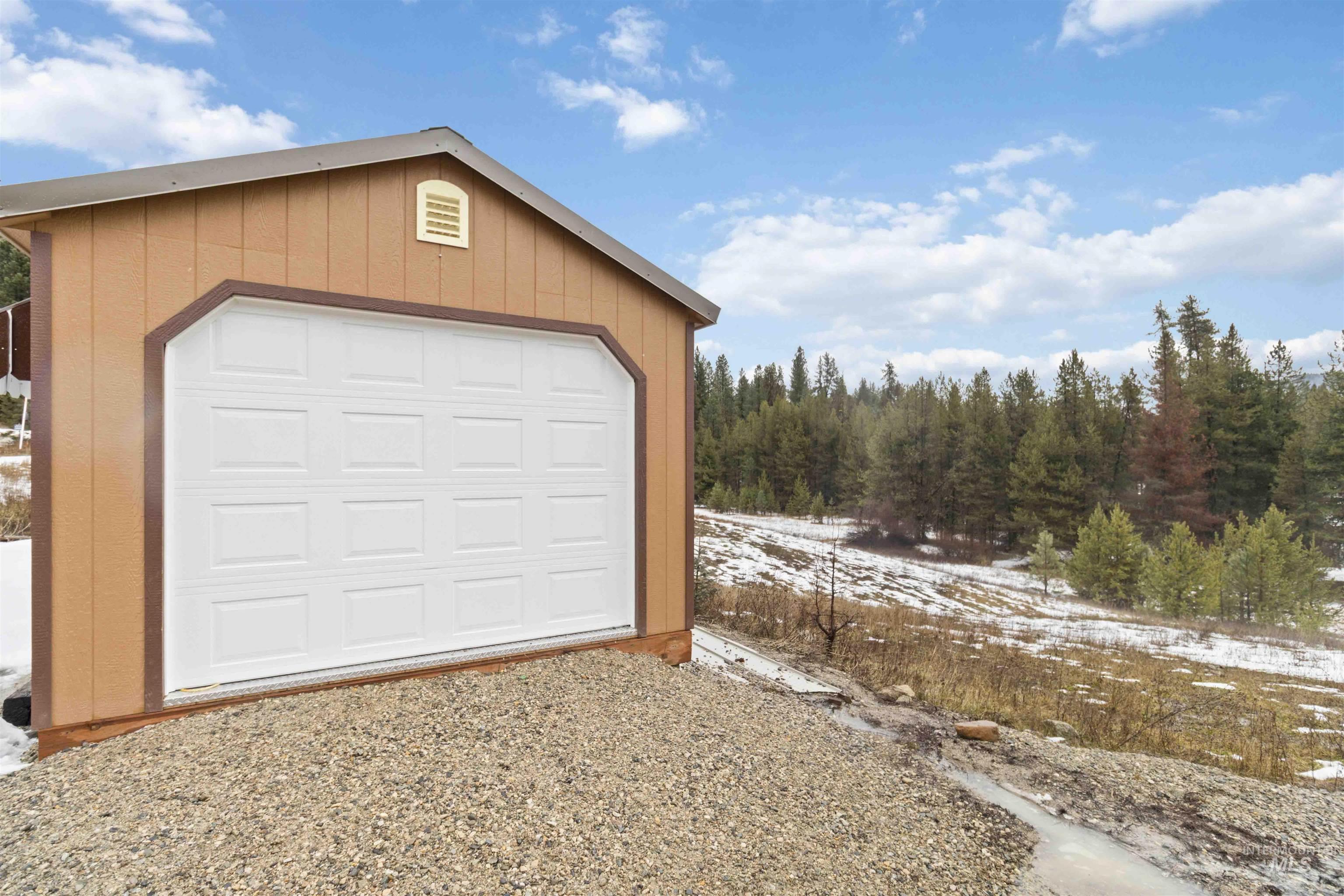 9592 Packer John Road Cascade, ID 83611 - Photo 46 of 47 View of snow covered garage