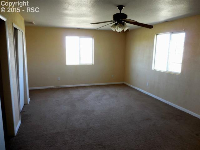 3585 South Yoder Road Yoder, CO 80864 - Photo 7 of 11 Large master bedroom