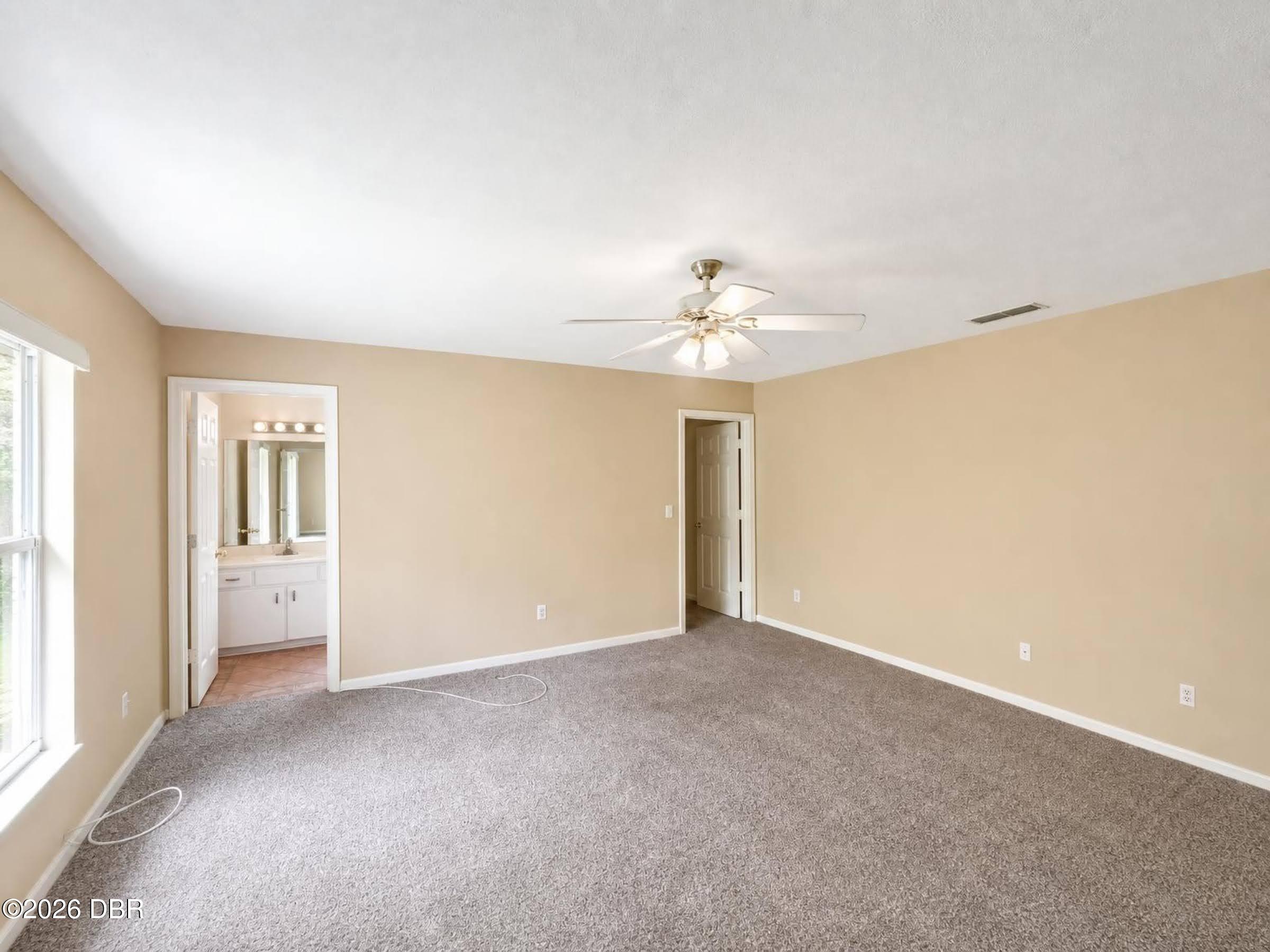 5909 Springview Drive Port Orange, FL 32127 - Photo 7 of 11 10-interior_primary_bedroom