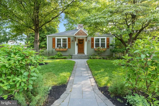 a front view of a house with yard