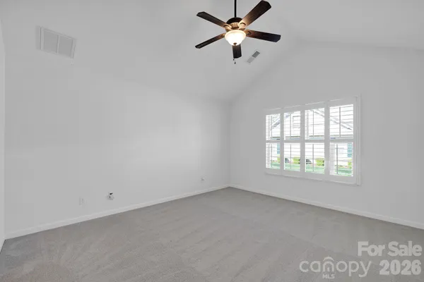 a bathroom with a shower a toilet and a sink