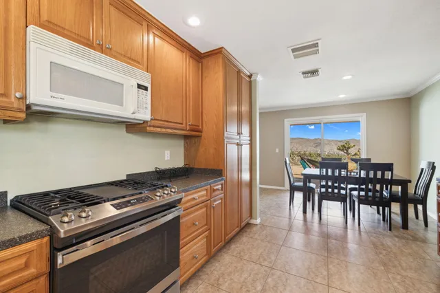 a view of a hallway with wooden floor and glass door