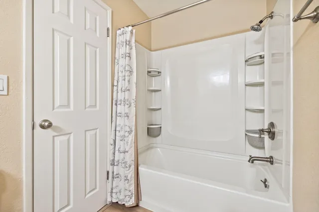 a view of a bedroom with walk in closet and bedroom