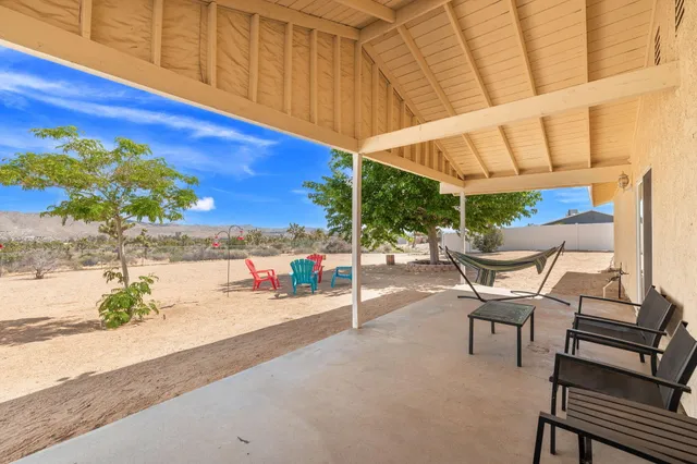 a view of a chairs and table in the patio
