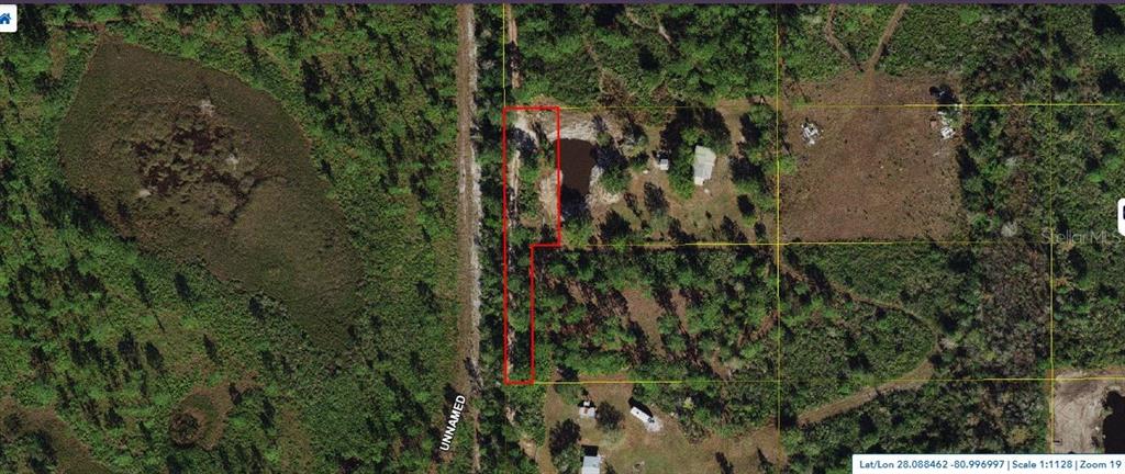 Palm Frond Rd Street St. Cloud, FL 34773 - Photo 1 of 3 a view of a yard of a building