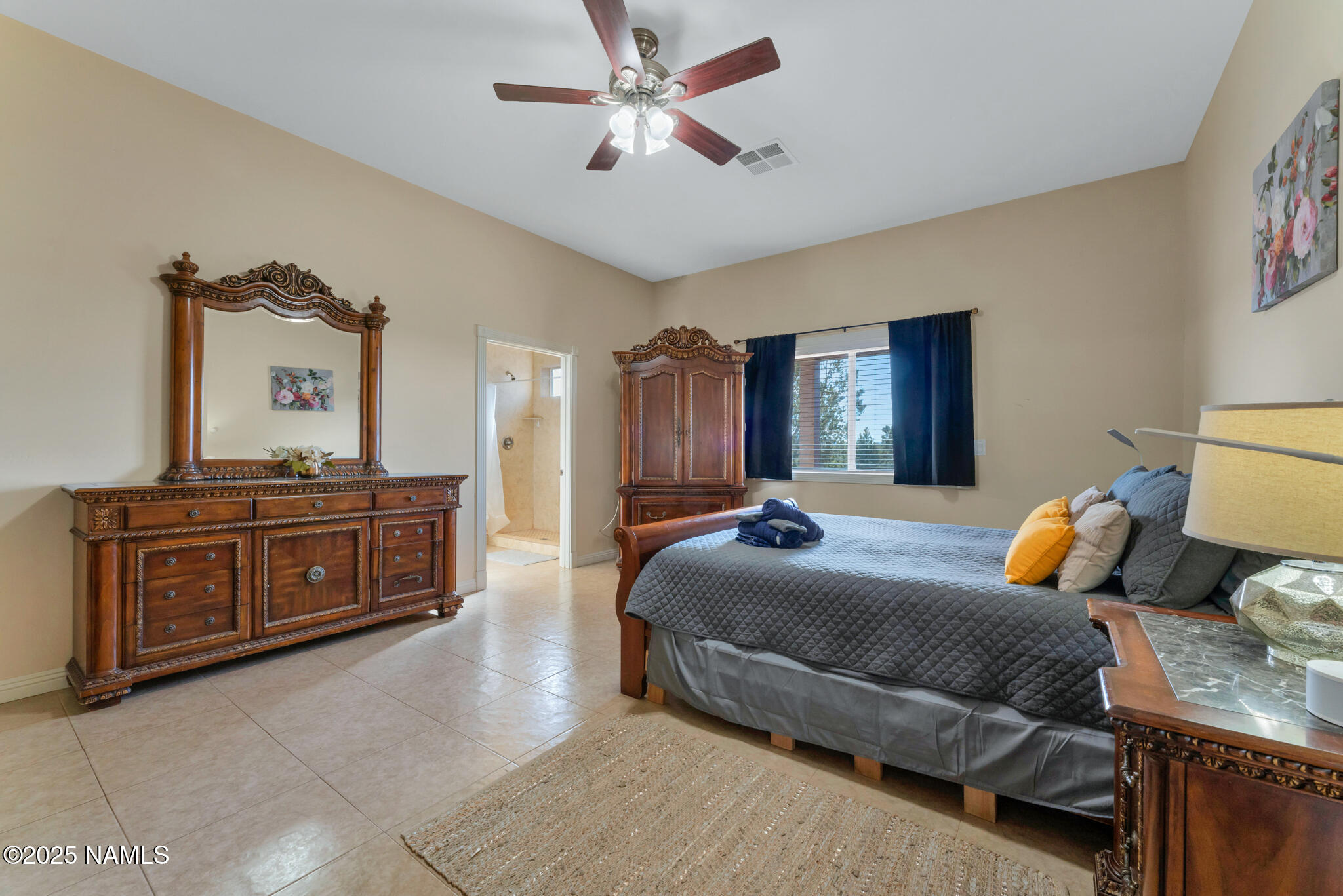 8752 South Lariat Road Williams, AZ 86046 - Photo 11 of 38 a bedroom with a bed and dresser