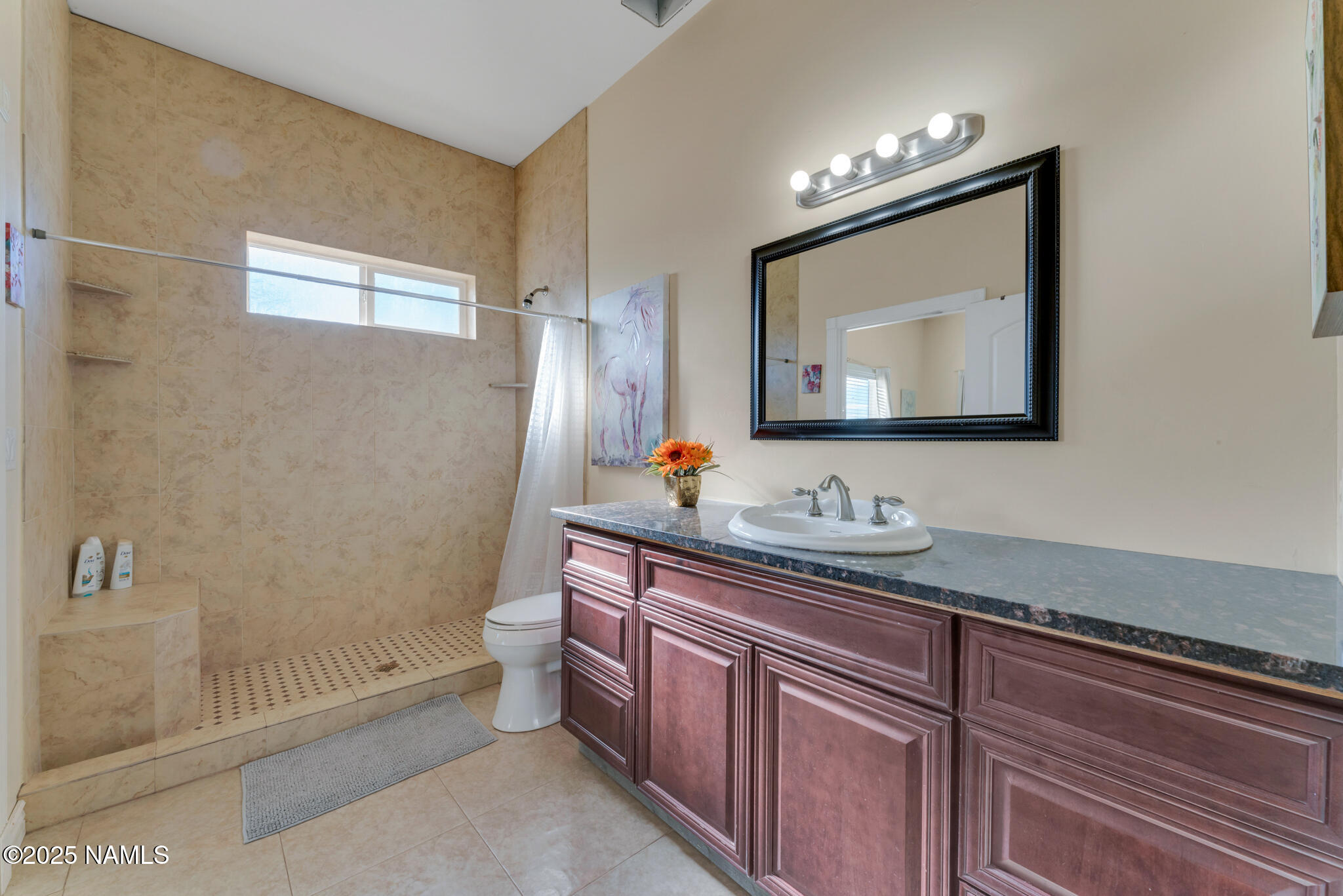8752 South Lariat Road Williams, AZ 86046 - Photo 12 of 38 a bathroom with a toilet sink and mirror