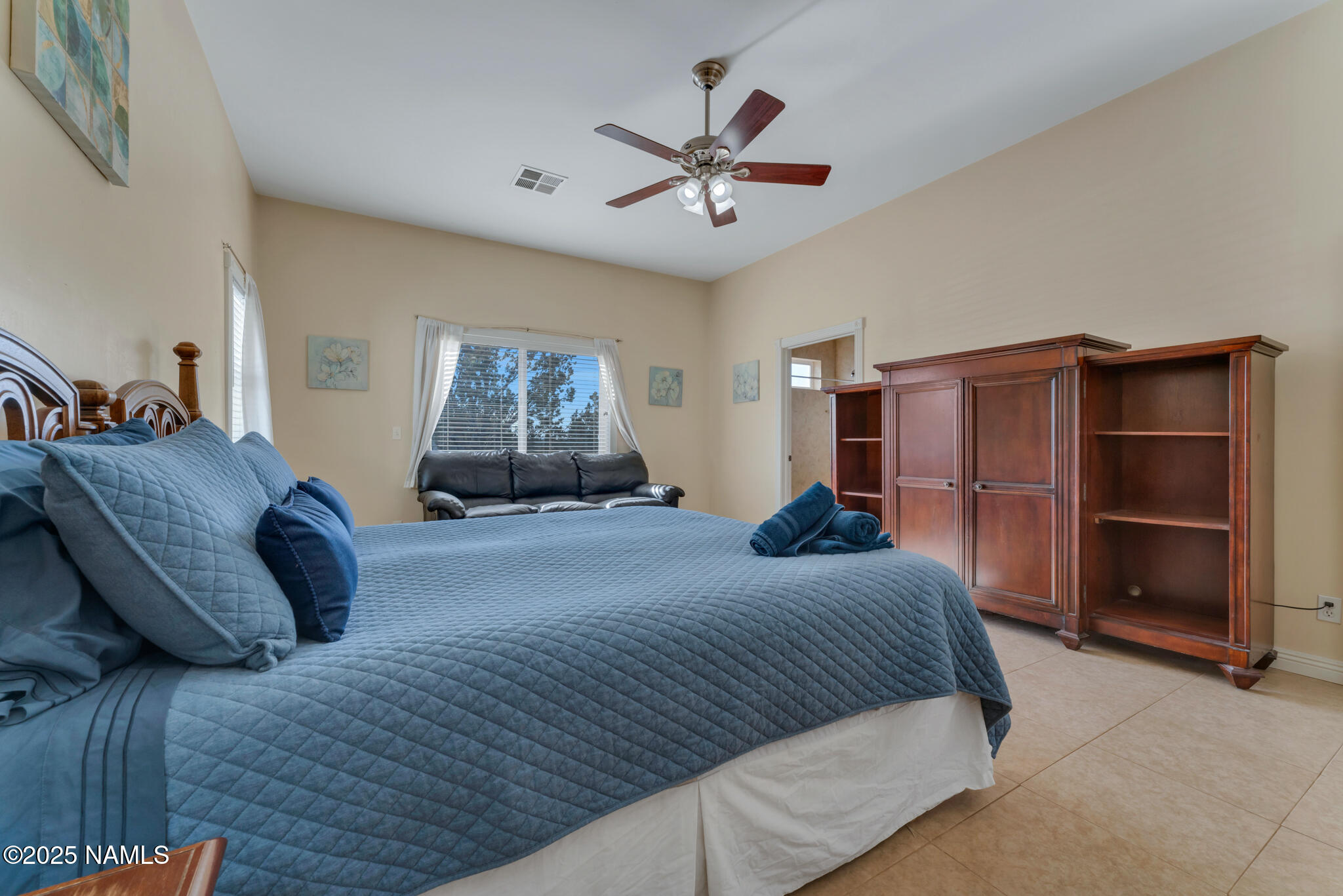 8752 South Lariat Road Williams, AZ 86046 - Photo 15 of 38 a bedroom with a bed and window