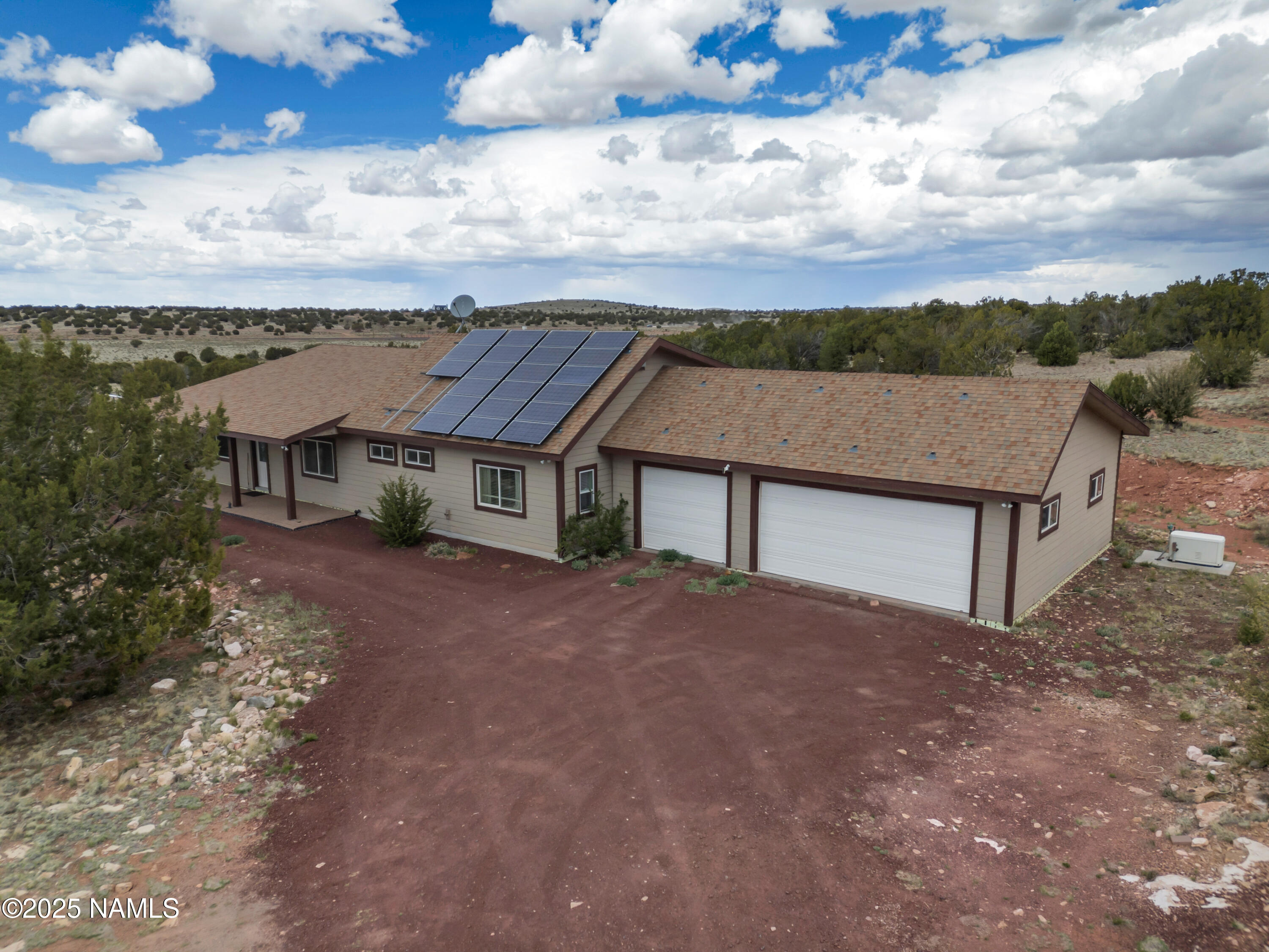 8752 South Lariat Road Williams, AZ 86046 - Photo 21 of 38 a view of a house with a big yard