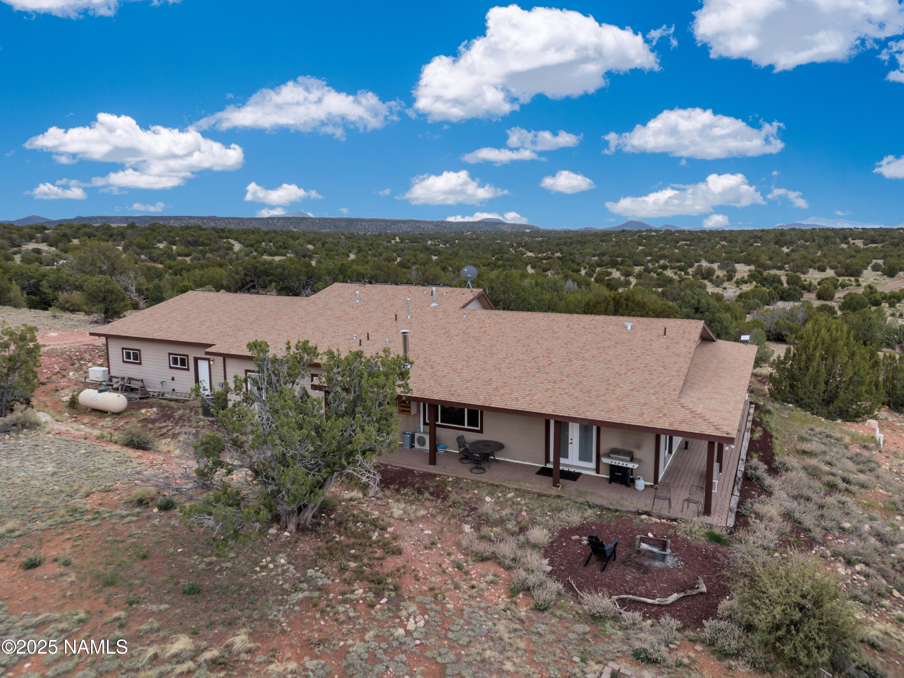 8752 South Lariat Road Williams, AZ 86046 - Photo 25 of 38 an aerial view of a house with a yard