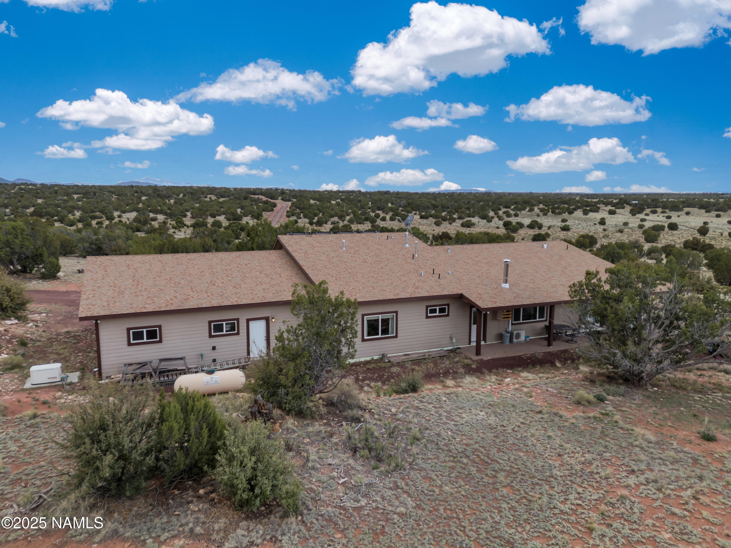 8752 South Lariat Road Williams, AZ 86046 - Photo 26 of 38 a view of a house with a yard