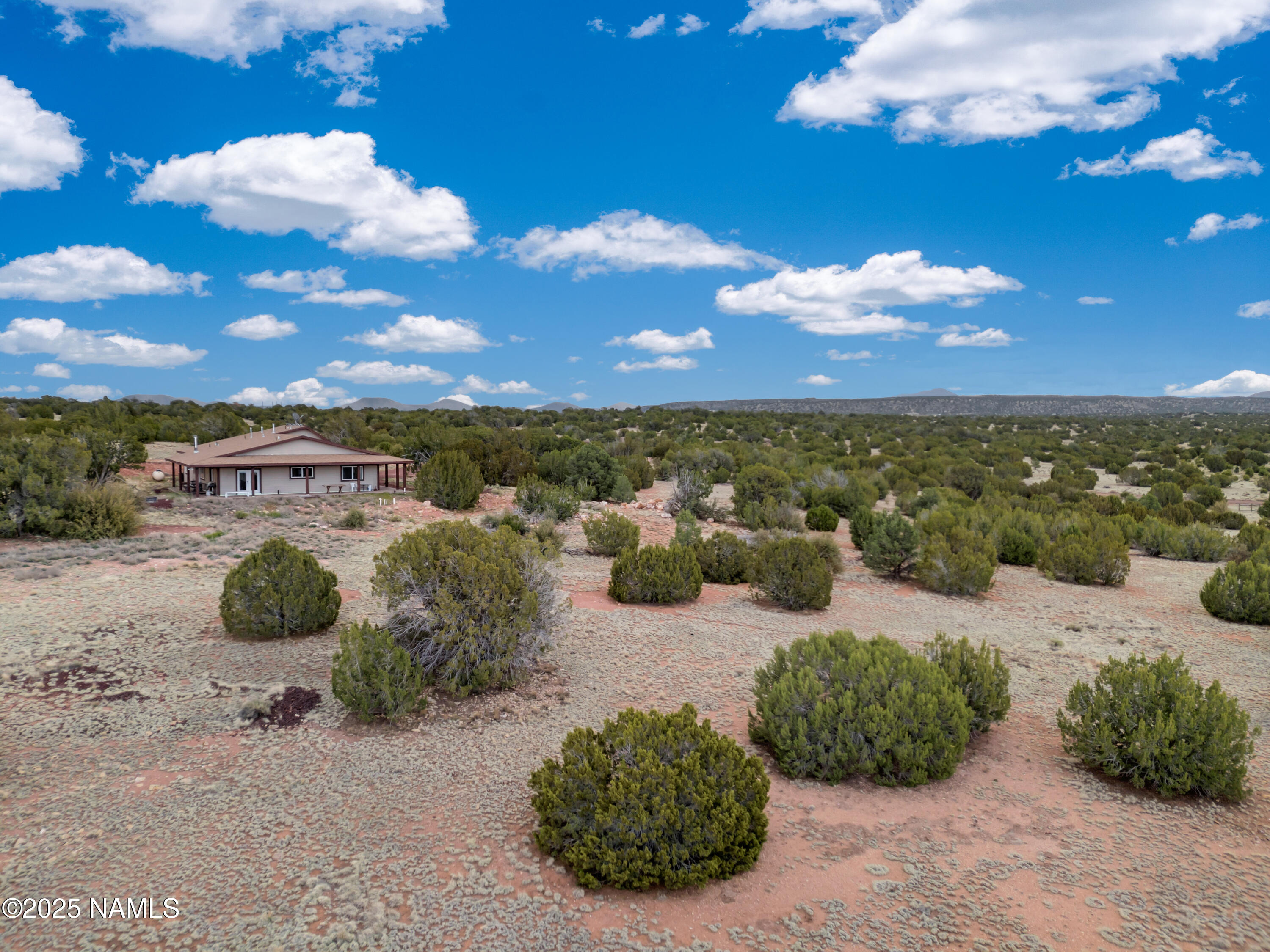 8752 South Lariat Road Williams, AZ 86046 - Photo 27 of 38 a view of a lake with lawn chairs