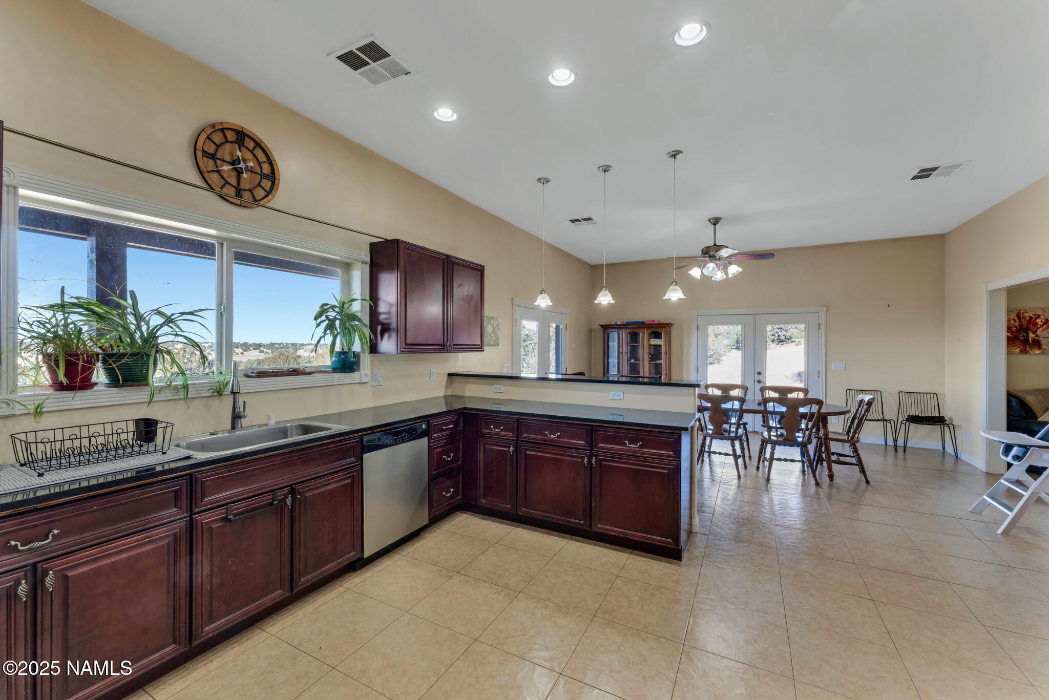 8752 South Lariat Road Williams, AZ 86046 - Photo 7 of 38 a large kitchen with stainless steel appliances a counter space a sink and a refrigerator