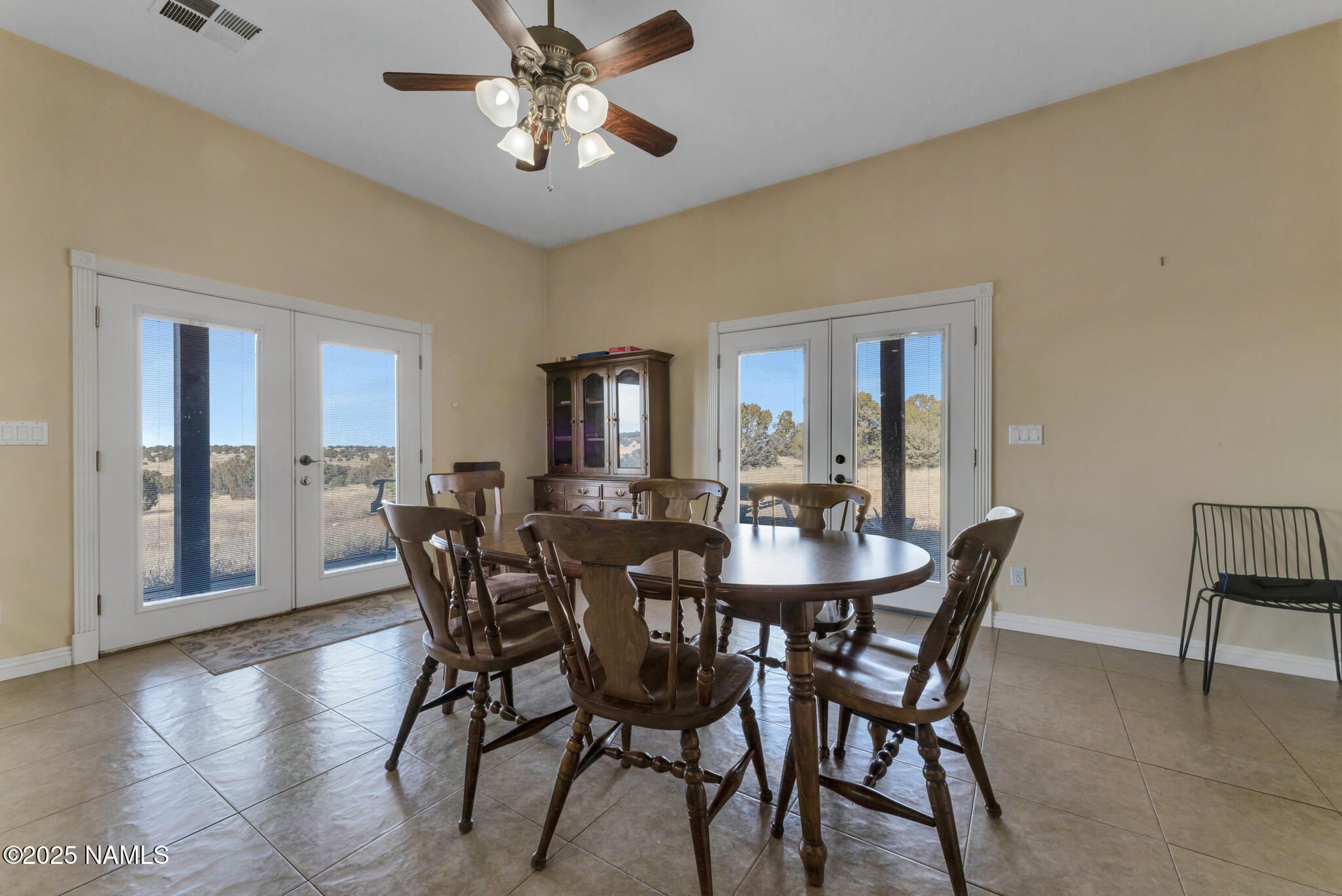 8752 South Lariat Road Williams, AZ 86046 - Photo 8 of 38 a view of a dining room with furniture and wooden floor