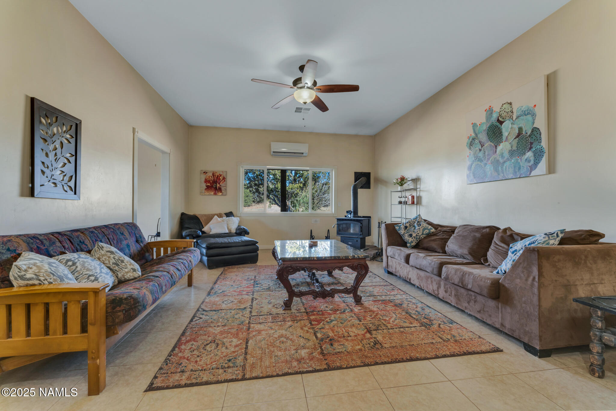 8752 South Lariat Road Williams, AZ 86046 - Photo 9 of 38 a living room with furniture and a large window