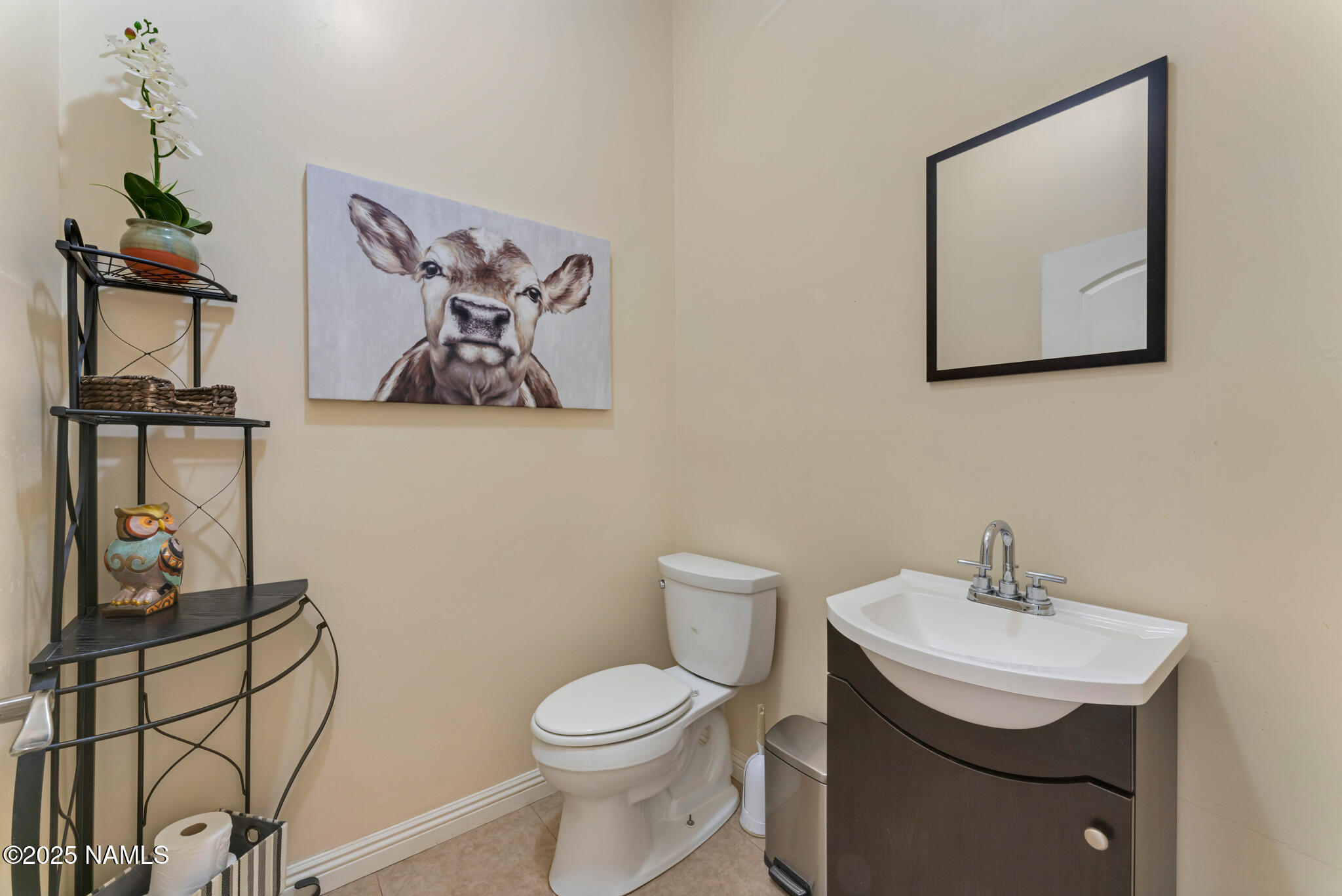 8752 South Lariat Road Williams, AZ 86046 - Photo 10 of 38 a bathroom with a toilet a sink and mirror