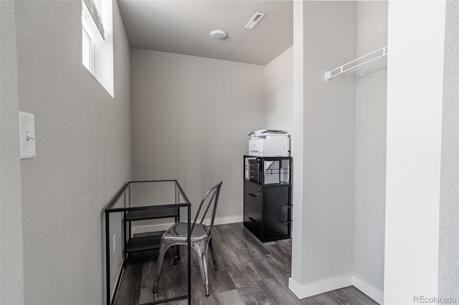 3301 Sandy Harbor Drive Evans, CO 80620 - Photo 11 of 27 a view of a dining room with furniture and wooden floor