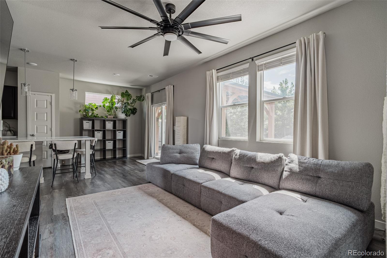 3301 Sandy Harbor Drive Evans, CO 80620 - Photo 14 of 27 a living room with furniture and a large window