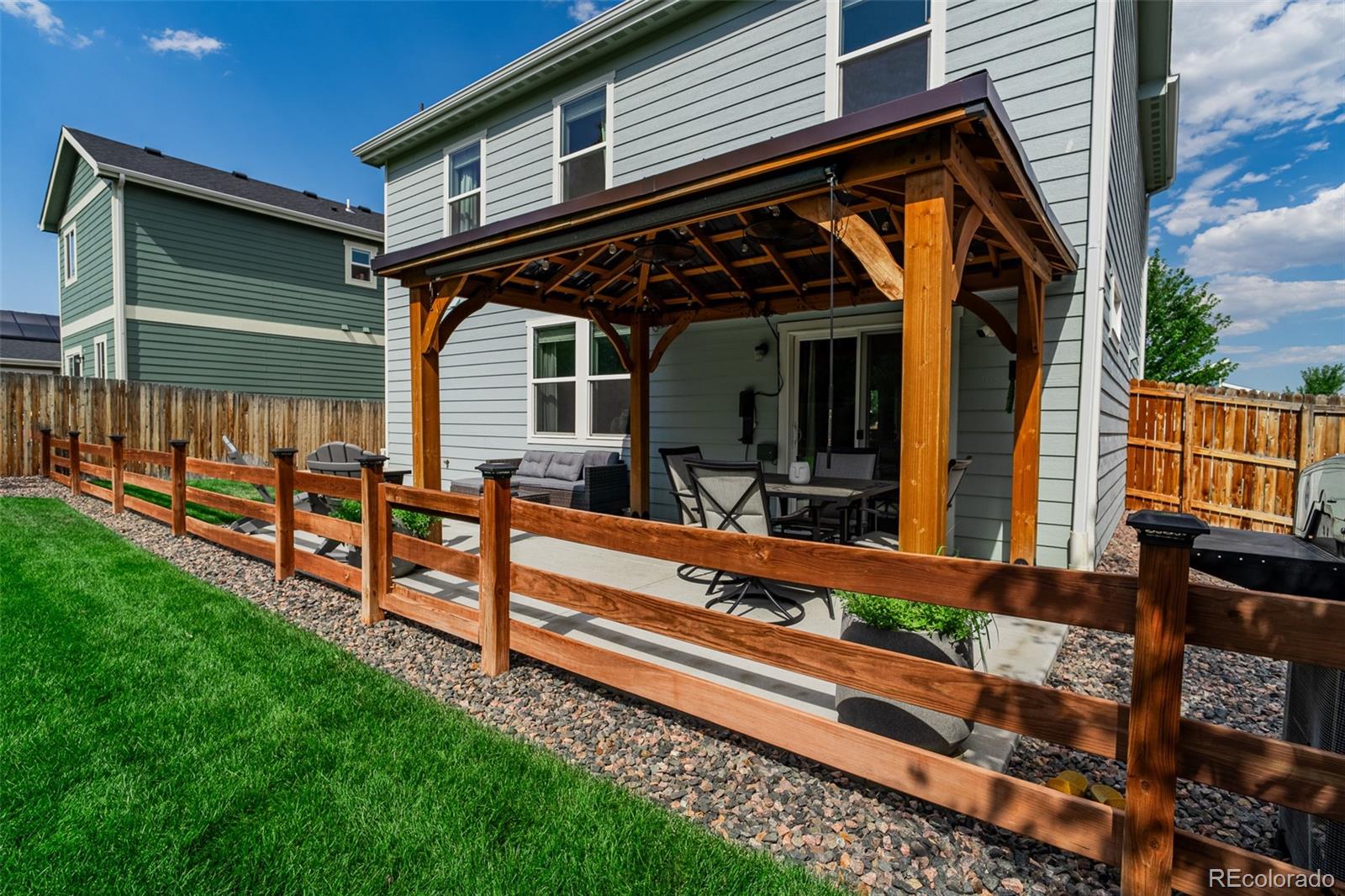 3301 Sandy Harbor Drive Evans, CO 80620 - Photo 22 of 27 a view of a house and wooden deck
