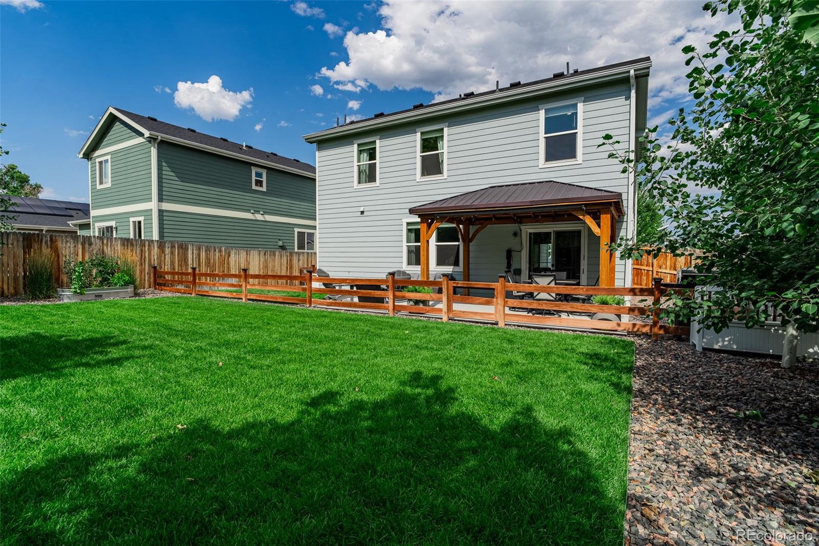 3301 Sandy Harbor Drive Evans, CO 80620 - Photo 27 of 27 a front view of house with yard and outdoor seating