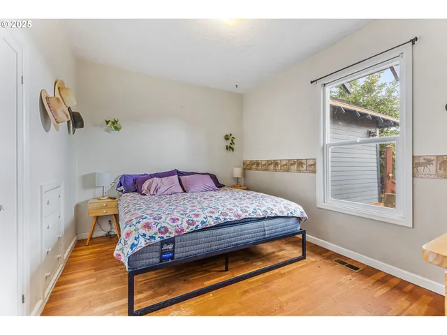 a bedroom with a bed and window