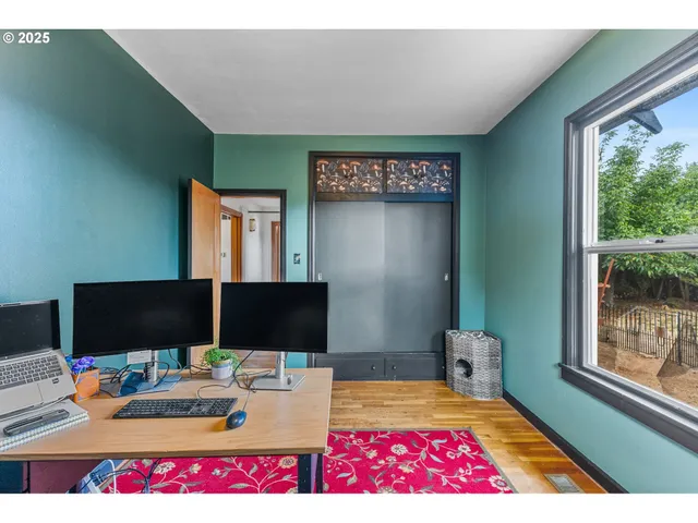 a picture of a room with furniture and a window