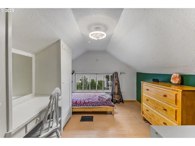 a bedroom with a bed and furniture