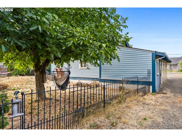 aerial view of a house with a yard