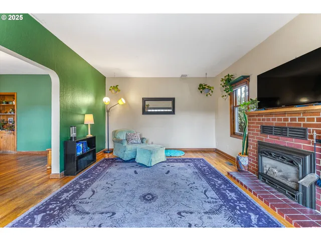 a view of a livingroom with furniture and a flat screen tv