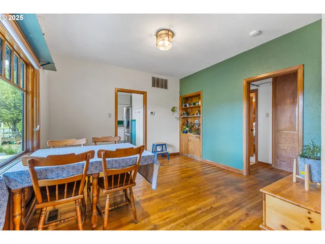 a dining room with furniture and window