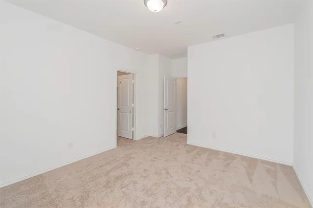 a bath tub sitting next to a white sink and vanity