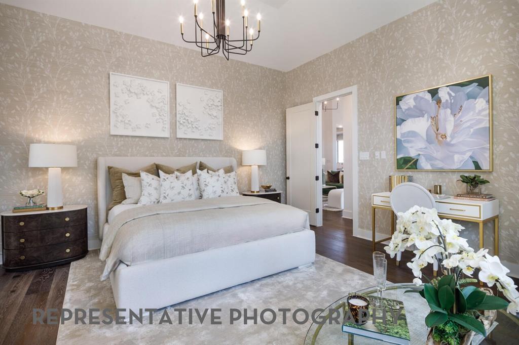 3625 Meander Way Prosper, TX 75078 - Photo 14 of 40 a spacious bedroom with a bed and a chandelier