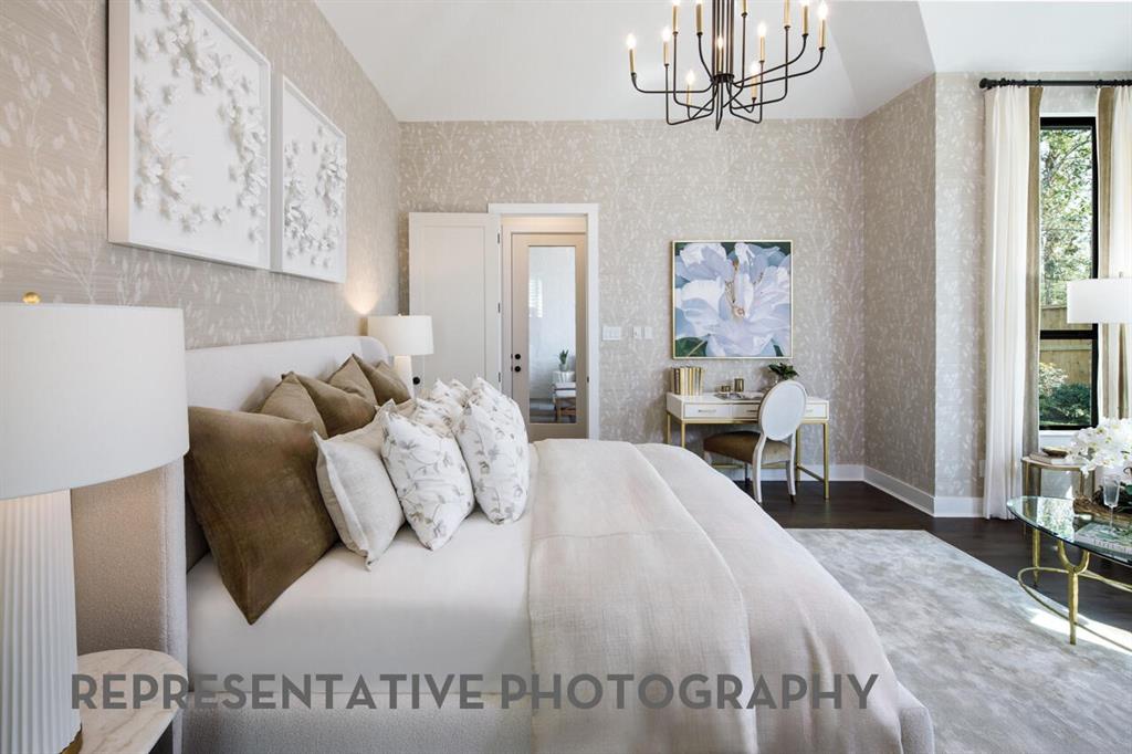 3625 Meander Way Prosper, TX 75078 - Photo 15 of 40 a bedroom with a bed and a chandelier