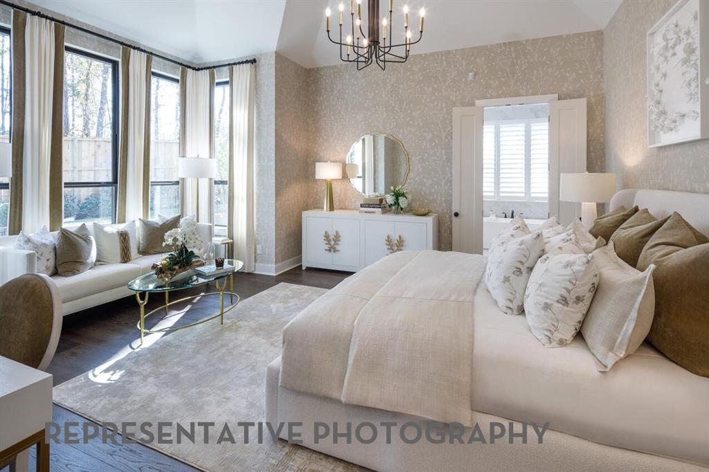 3625 Meander Way Prosper, TX 75078 - Photo 17 of 40 a spacious bedroom with a bed a couch and large windows