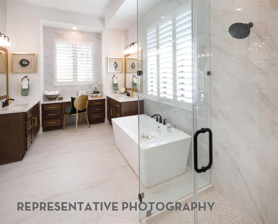 3625 Meander Way Prosper, TX 75078 - Photo 20 of 40 a bathroom with a tub sink and mirror