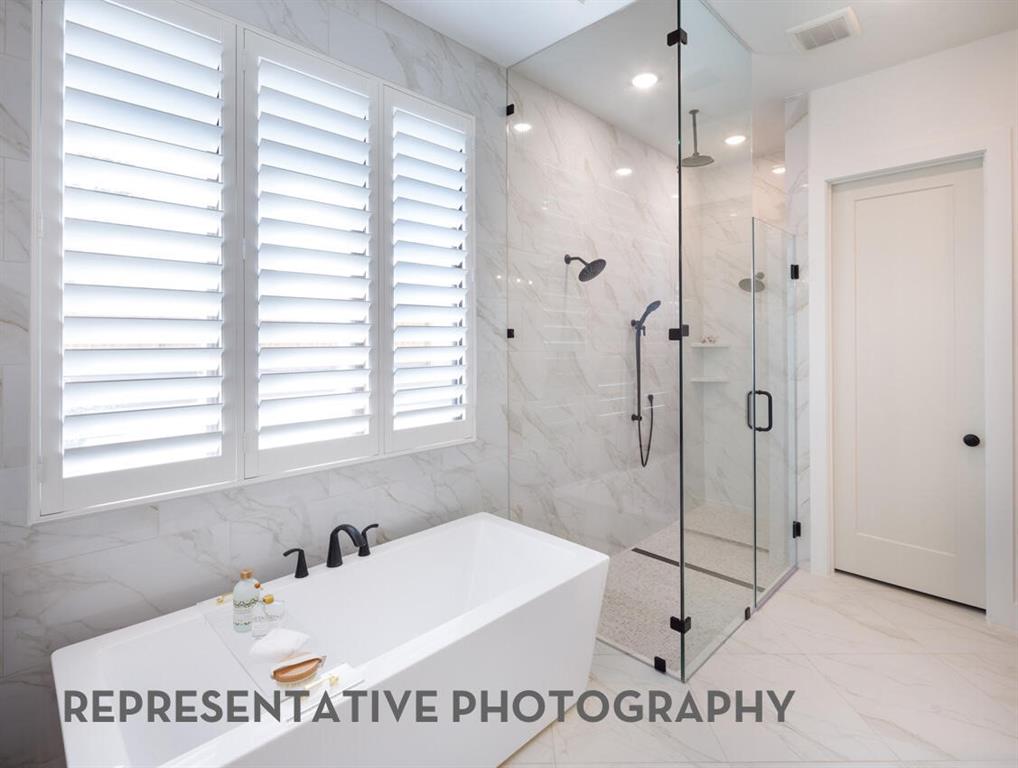 3625 Meander Way Prosper, TX 75078 - Photo 21 of 40 a bathroom with a sink a mirror and a shower