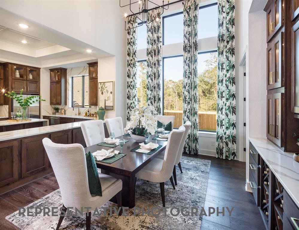 3625 Meander Way Prosper, TX 75078 - Photo 31 of 40 a view of a dining room with furniture window and wooden floor