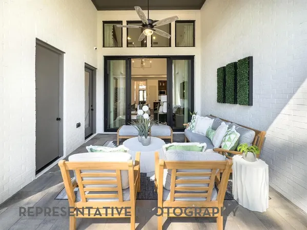 a dining room with furniture and a window