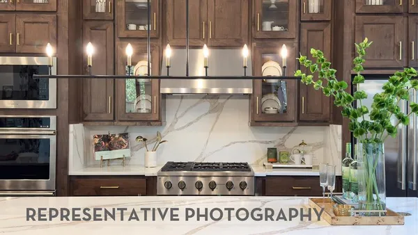 a kitchen with a stove and cabinets