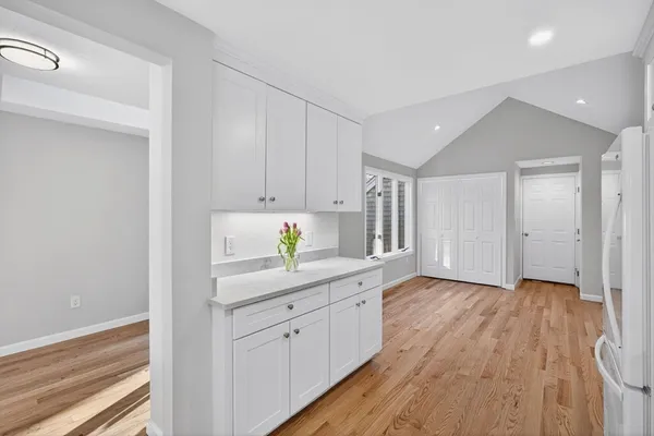 a kitchen with a sink and cabinets