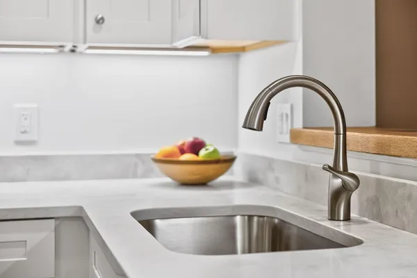 a close view of a sink and tap