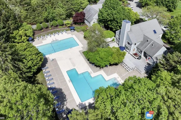 an aerial view of a house with a garden