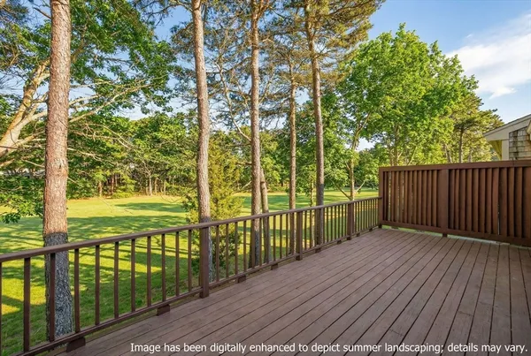 a view of a balcony with wooden floor