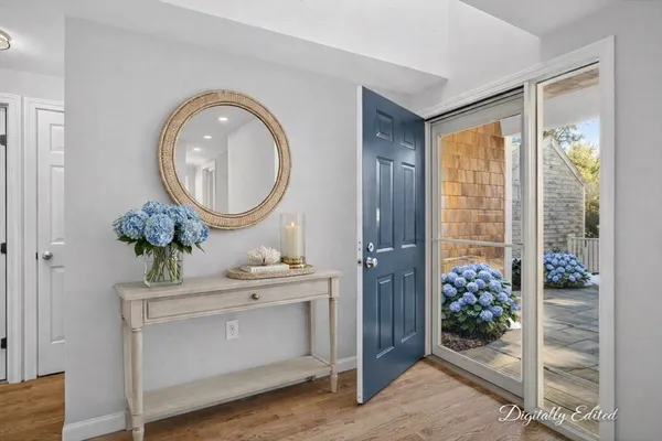 a bathroom with a tub sink and mirror