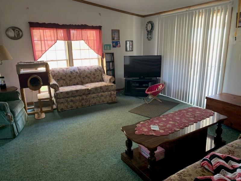 1637 Deerfield Road Washington, PA 15301 - Photo 3 of 12 a bedroom with a bed and a flat screen tv