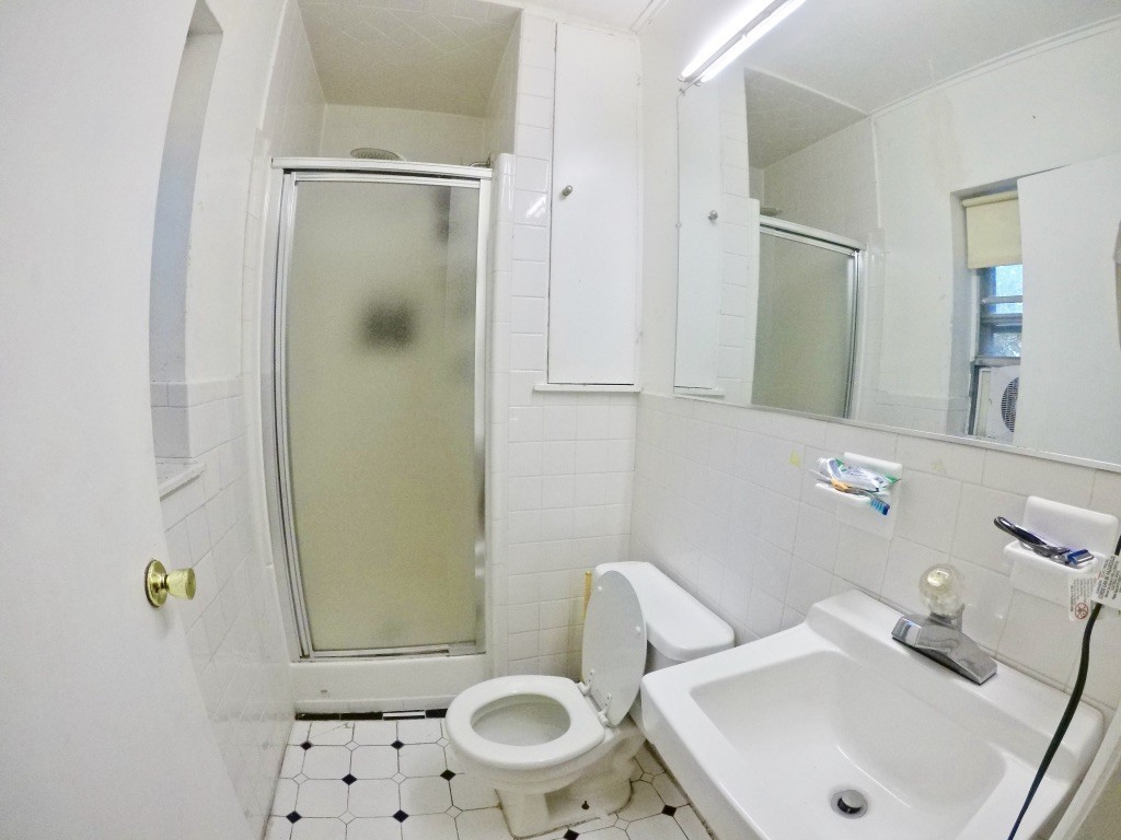 210 Lake Shore Road, Unit 3 Boston, MA 02135 - Photo 16 of 20 a bathroom with a sink a toilet and shower